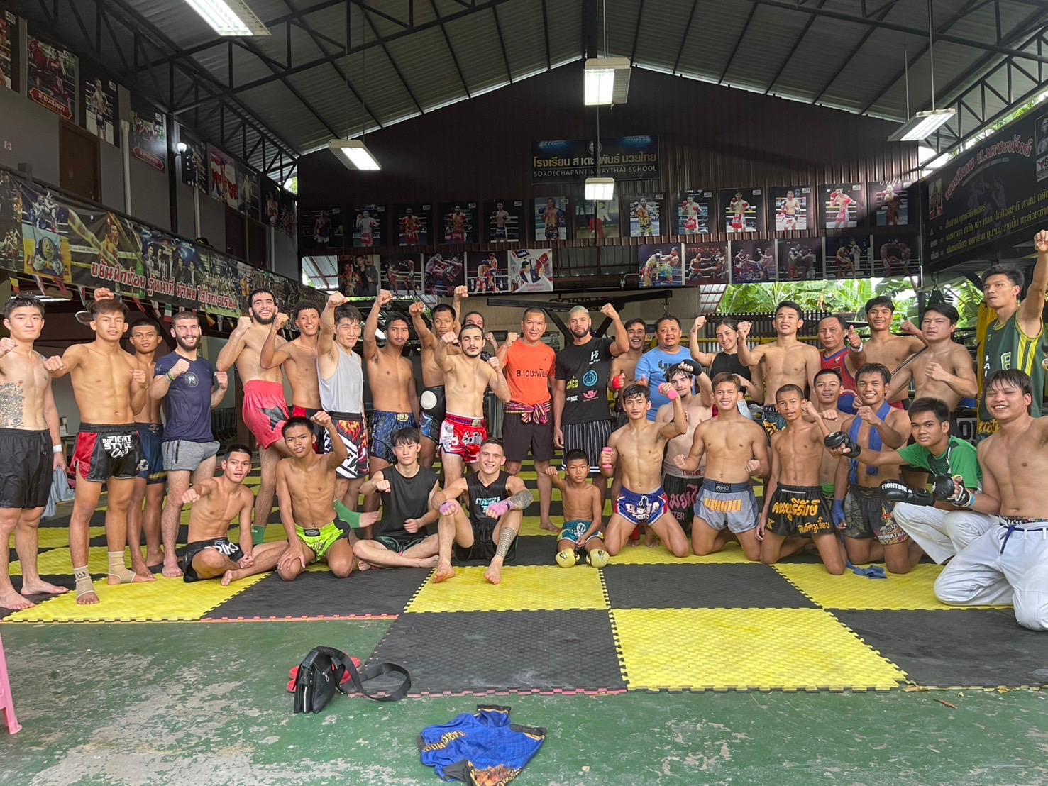 Sor.Dechapant Muay Thai gym in Bangkok — fighters training on the gym floor